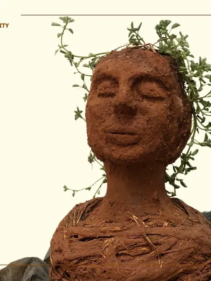 This sculpture, 'Dirty Fertility', is made from soil and explores the connection between Mother Earth and the taboos surrounding female fertility. It's a piece that asks us to reconsider what we label as 'dirty' and what we hold sacred.
