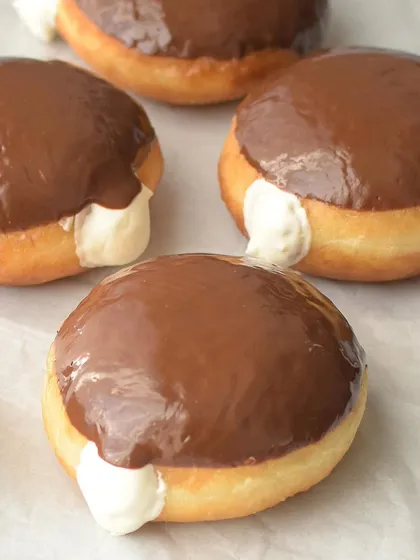 My Boston Cream doughnuts are a classic favorite. The light brioche is filled with a vanilla bean custard and topped with a rich dark chocolate glaze.