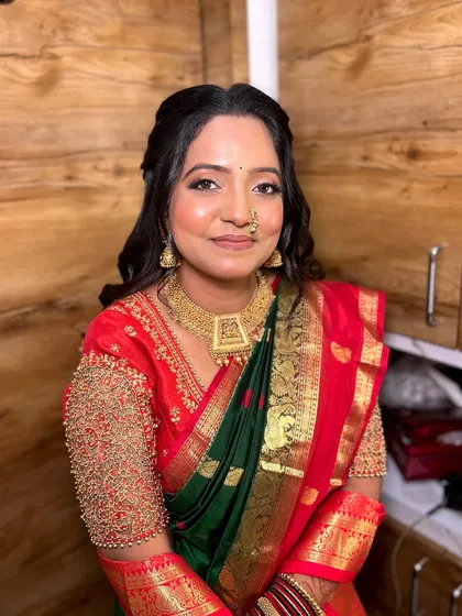 A poised and elegant portrait. The lighting highlights the flawless, skin-like finish of the makeup, which is a cornerstone of my technique for every bride.