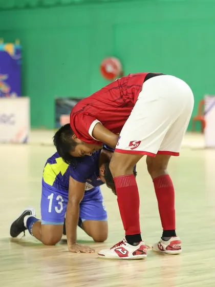 Respect above all. Helping a fallen opponent from Bhawanipore FC during the hard-fought final.
