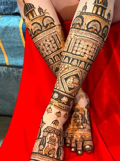 A unique angle showing the intricate designs on the legs. The patterns are dense and feature architectural and geometric motifs.