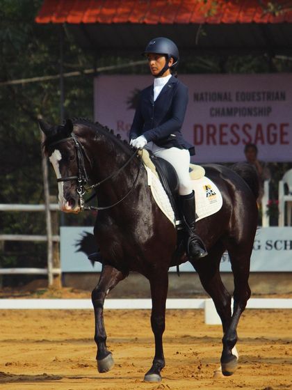 Another shot of Sanyogeeta and Christy during their second-place performance in the NEC Advance Dressage. Their harmony and precision are a testament to our rigorous training program.