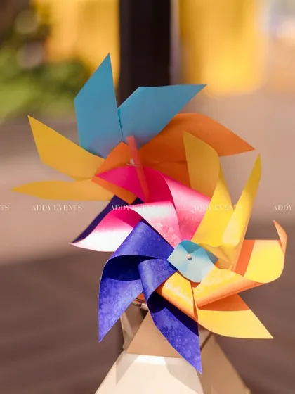 Colorful paper pinwheels used as a playful and vibrant decor accent.