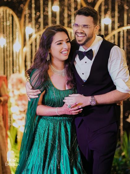 A candid moment of laughter between Pragya and Akhil at their reception. Our goal is to create a relaxed and joyful atmosphere where couples can truly enjoy their celebration.