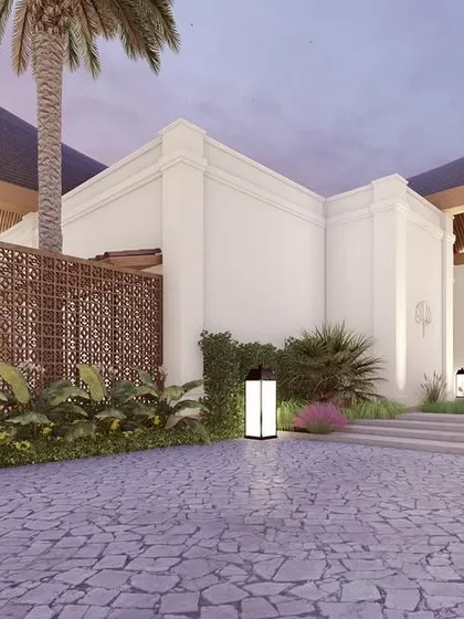 A render of the "Kettuvallam" driveway and side elevation, highlighting the intricate screen work and lush landscaping that will envelop the home. This image captures the complete vision of a tranquil, modern sanctuary.