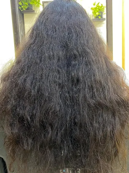 This client came in with a full mane that needed structure. By using my dry-cutting technique, I was able to carve out a shape that enhanced her curl clumps and gave her hair beautiful definition.