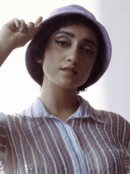 A soft, retro-inspired look for Sanjeeta, featuring a striped shirt and bucket hat. This shows my versatility in creating different moods for a single project.