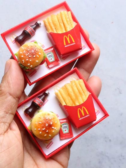 A pair of McDonald's meal tray magnets, a fun addition to any fridge.