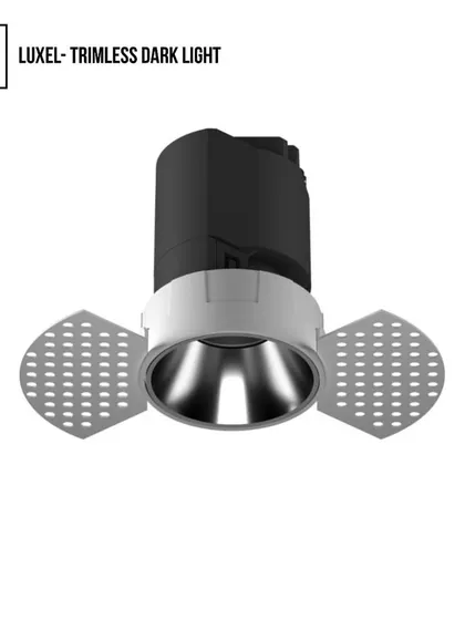 This is the trimless version of our Luxel Dark Light. The trimless design allows the fixture to be plastered into the ceiling, creating a seamless, fully integrated look where the light appears to emerge from the architecture itself.