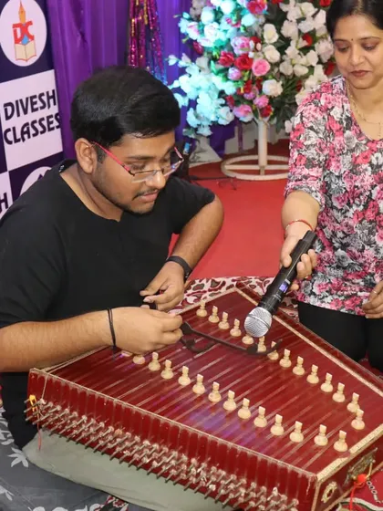 A student showcasing his musical talent on the santoor at the farewell party. We are proud to have such multi-talented individuals in our classes.