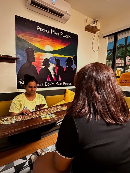 I am who I am wherever I go. Here I am doing an in-person reading at a cozy cafe. I feel so blessed to be able to carry this magic with me and create a sacred space no matter the location.