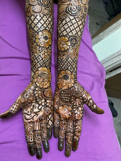 A close-up of the palms on a purple background.