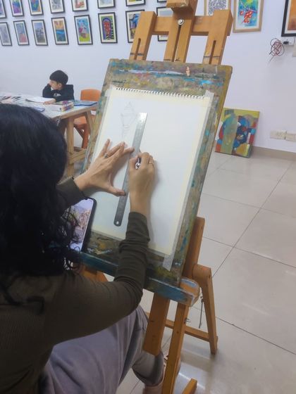 The process of creating a watercolor street scene, from the initial sketch to the final color washes.