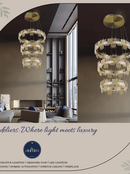 The three-tiered ring chandelier is shown here in a spacious, modern living room. Its grand scale and luxurious materials, including brushed gold and textured glass, make it the undeniable centerpiece of the room.