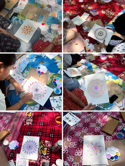 A bird's-eye view of the creative process during our art picnic. Everyone is focused and in their own world, yet we are all connected through the shared experience of making art.