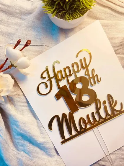 A "Happy 18th Moulik" topper, ready to celebrate a major birthday.