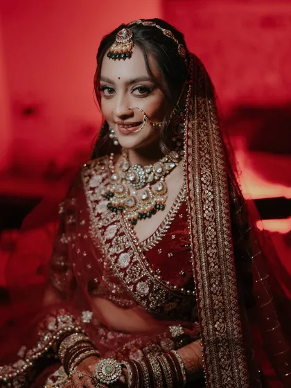 A bride is a story in herself. I use light and shadow to capture the anticipation, the grace, and the powerful emotion in her eyes just moments before she begins her new chapter. This is her moment, captured in all its glory.