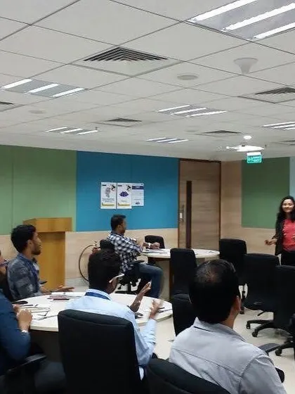 Leading a workshop in a corporate training room. My sessions are tailored to the specific needs of the team, whether they are focusing on communication, leadership, or professional etiquette.