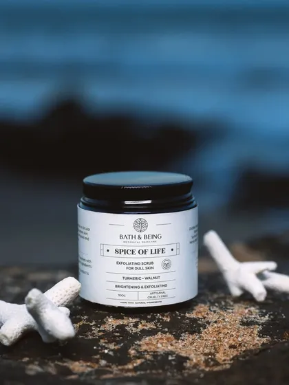 The Spice of Life Walnut Scrub for face and body. Finely milled walnut powder gently buffs away dullness, while wild turmeric extract brightens your skin for a radiant, even-toned glow.