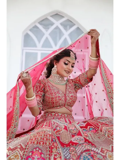 Another beautiful shot of a bride against our 'White House' backdrop. The simplicity of the set ensures that the focus remains entirely on the bride and her intricate outfit.