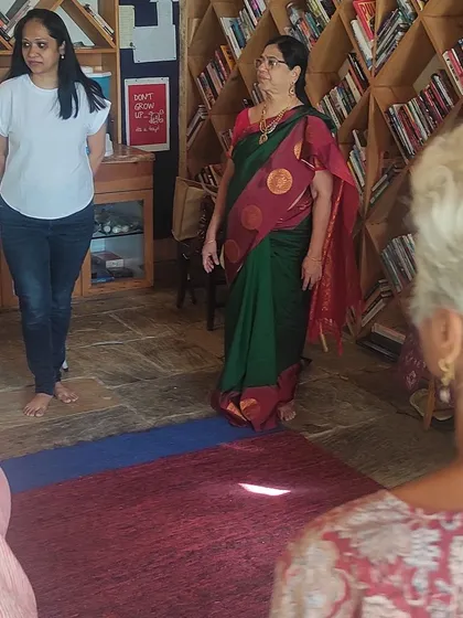 Guiding a participant through an exercise during the Himalayan retreat. The small group size allows for personal attention and deeper exploration.