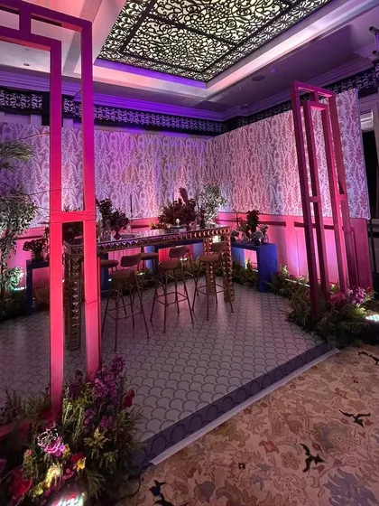 A wider view of the custom pink gazebo I built for a sangeet bar area. This structure creates an intimate yet glamorous space for guests to mingle.