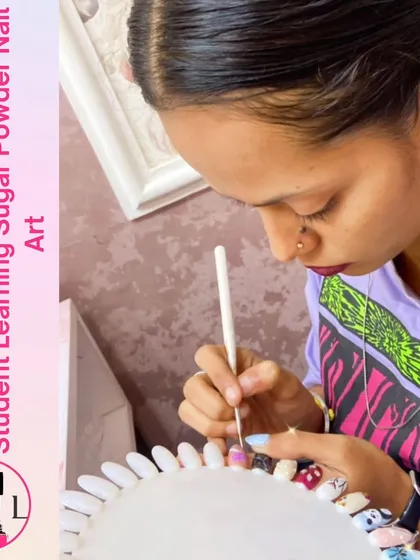 This student is learning how to create sugar powder nail art, a technique that gives a textured, crystallized finish.