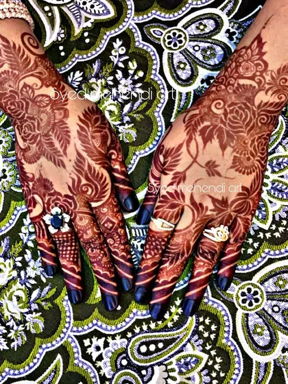 A stunning photo of a rich, dark henna stain against a colorful background.