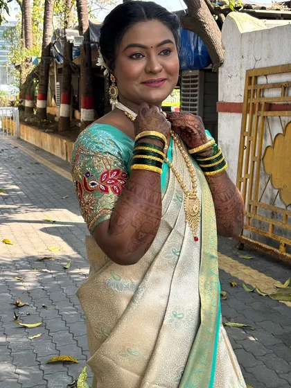 Another angle in natural light, showcasing the elegant saree and makeup.