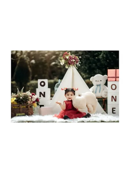 A playful moment with a fluffy tooth prop during a first birthday shoot. I love adding unique and fun elements to make each session special.