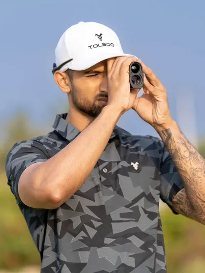 Using a rangefinder to gauge distance is an essential part of smart golf. We coach players on how to use technology to make better decisions on the course.