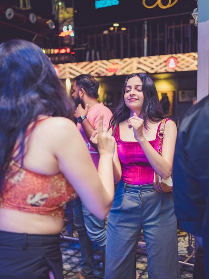 Two guests dancing together, lost in the music.