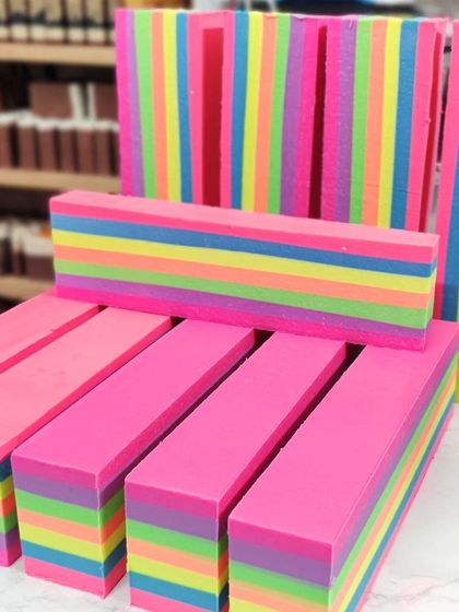 The cut logs of my Frozen Yogurt soap, showing off the clean, vibrant rainbow layers. These will be cut into individual bars and then frosted.