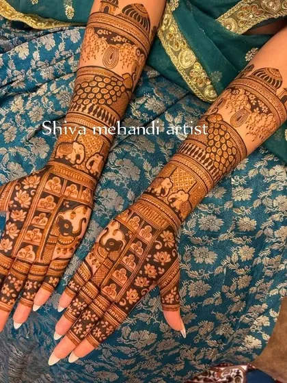 An intricate design featuring rows of elephants and lotus flowers, symbolizing strength and purity. The fingertips are left open for a modern touch.
