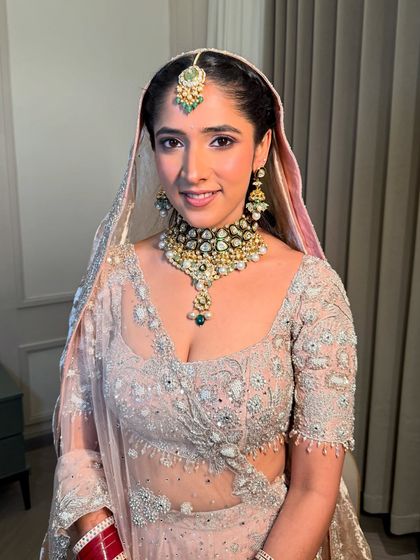 Anmol looking serene and beautiful. The pastel tones of her outfit are reflected in the soft, rosy tones of her makeup.