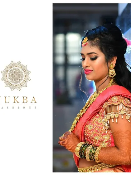 A side profile of the bride in her custom pink lehenga, showing the intricate zardosi work and the elegant silhouette of the outfit.