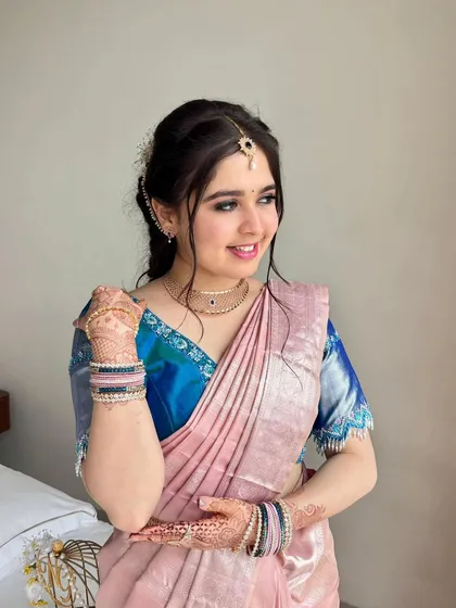 Payal showing off her beautiful henna, with her makeup looking fresh and flawless.