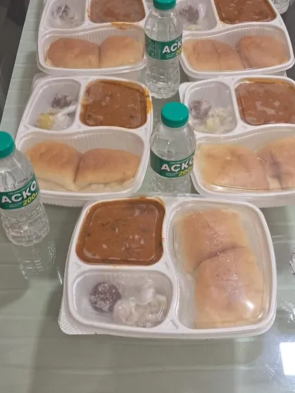 Our complete meal combo, including Pav Bhaji, a sweet, salad, and a bottle of water. We provide a full and satisfying meal solution.