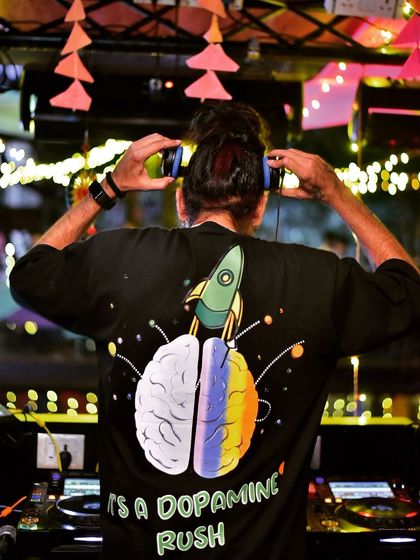 A shot from behind showing my 'Dopamine Rush' shirt. That's exactly what I want my music to feel like.