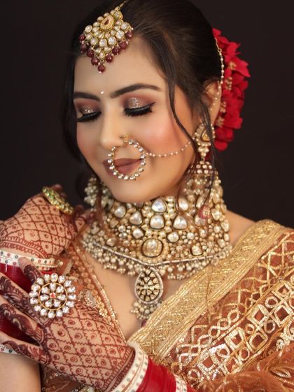 My gorgeous bride Sanjeee. I created a beautiful look with glittery eyes, radiant skin, and a soft lip, all complementing her stunning jewelry.
