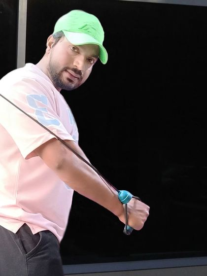 Performing a cable crossover exercise to target the chest muscles. Using machines helps in isolating specific muscle groups for better definition.