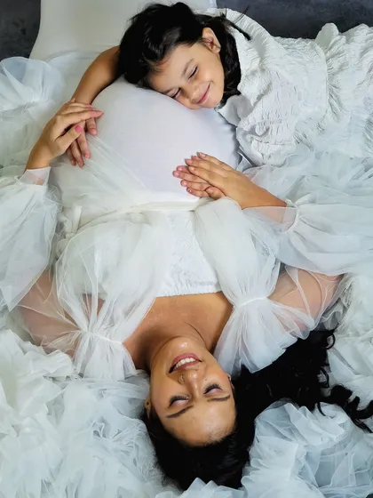 Maternity sessions are about celebrating the journey. This touching moment between a mother and her daughter as they anticipate the new arrival is a memory they will both treasure.