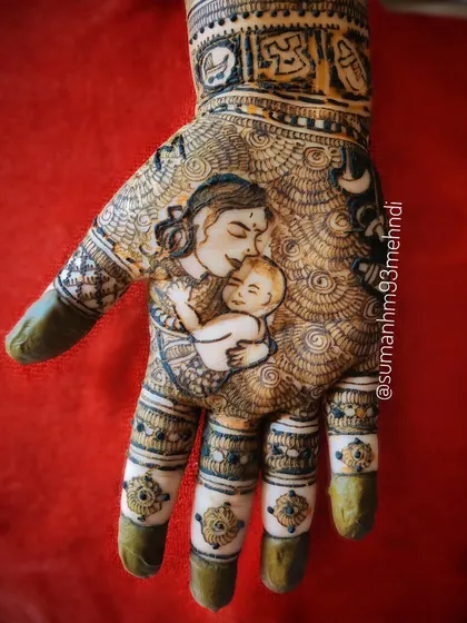 Capturing the beautiful bond between a mother and her child. This detailed portrait henna is a heartfelt way to celebrate motherhood, showing a mother lovingly holding her newborn.