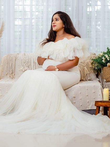 An identical shot to 75, this portrait highlights the elegance of the gown and the serene, stylish ambiance of the studio.