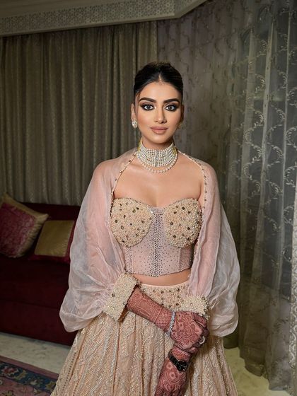A full look of Ishani's cocktail glam. The makeup is sophisticated and modern, perfect for a family wedding event.