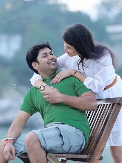 A happy and interactive moment by the river, with her arms around him. Their genuine smiles and the beautiful location make this a perfect pre-wedding photo.