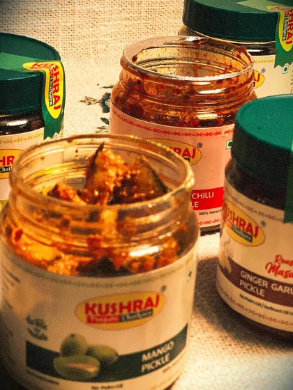 A glimpse of the variety I offer. Here you can see my tangy Mango Pickle, spicy Red Chilli Pickle, and the unique Ginger Garlic Pickle, all open and ready to be enjoyed. Each one is handmade with no artificial colours or preservatives.