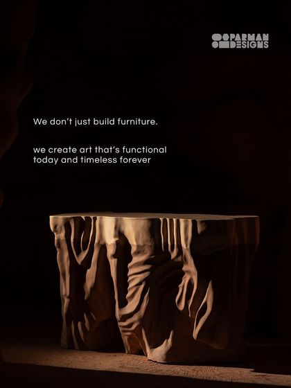 We don't just build furniture. We create art that's functional today and timeless forever, like this Roku Bar Table, carved to look like flowing rock.