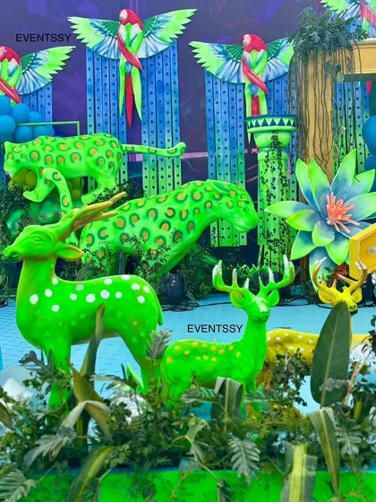 A group of neon green deer props, adding to the surreal and magical feel of the neon jungle.