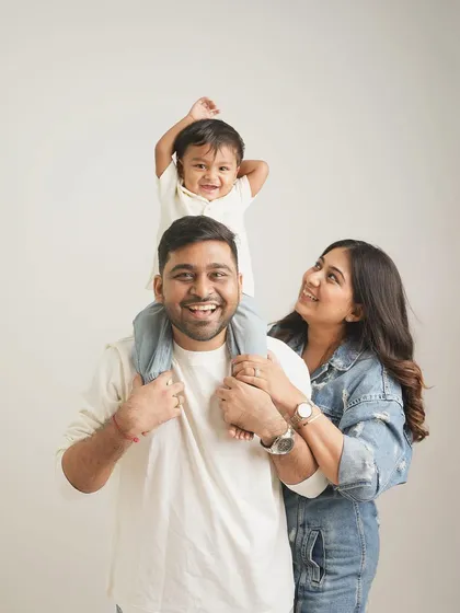 In my minimalist studio, your family is the entire focus. I love capturing the simple, happy moments, like this family portrait where the joy is so clear and genuine, creating a clean and timeless piece of art for your home.